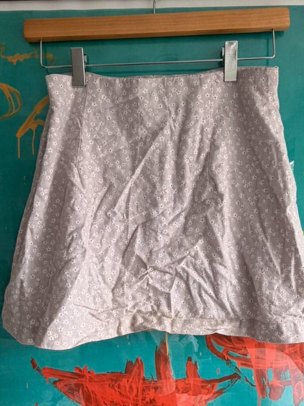 With Jean daisy pattern purple mini skirt.